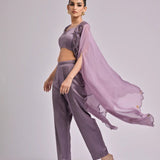 Red Long Cape Paired With An Overlapped Neck Bustier And Pleated Pants