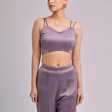 Red Overlapped Neck Bustier Paired With Pleated Pants