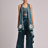 Teal Assymetrical Long Jacket Paired With A Printed Pleated Bustier And Solid Teal Pants