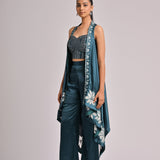 Teal Assymetrical Long Jacket Paired With A Printed Pleated Bustier And Solid Teal Pants