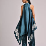 Teal Assymetrical Long Jacket Paired With A Printed Pleated Bustier And Solid Teal Pants